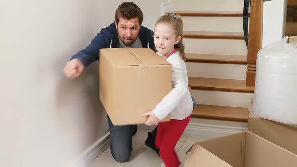 Couple unpacking cardboard boxes in there new home 4K 4k