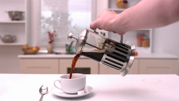 Coffee being poured in the kitchen