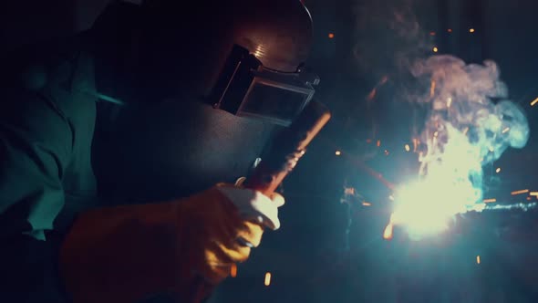 Metal Welder Working with Arc Welding Machine