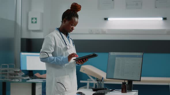 Woman Doctor Holding Digital Tablet with Touch Screen