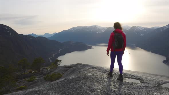 Adventurous Girl Hiking on Top of a Peak