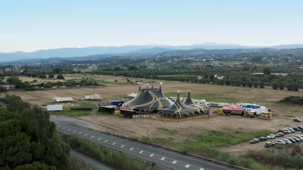 Yellow and Black Circus Tent in the Countryside Aerial View