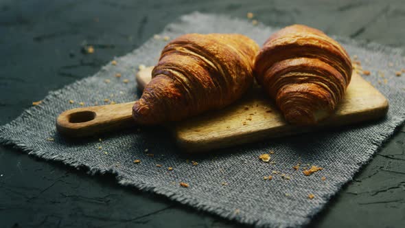 Fresh Croissants on Chopping Board