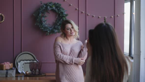 Beautiful Woman Poses To the Photographer at the Christmas Photoshoot, at the Photo Studio with