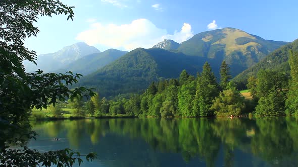 Sunny Day Near the Lake Under Hills