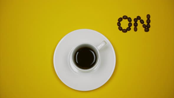 A Cup of Espresso With ON OFF Buttons on Yellow Background