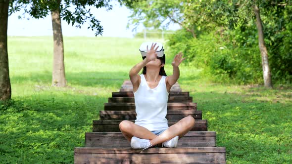 Woman watching with VR device at park