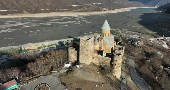 Aerial view of old Ananuri Fortress with two churches and picturesque view on river. Georgia 2022