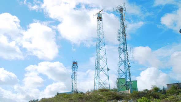 Coastal surveillance radar antenna and cell site tower, Low Angle Wide Shot