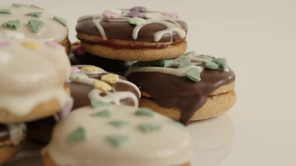 Pile of assorted  cookies with sprinkles 4K 2160p 30fps UltraHD footage - Stuffed sweet dessert on w