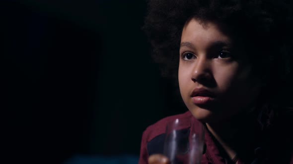 Closeup Cute Mixed Race Teen Drinking During Film
