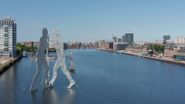 Forwards Fly Above Spree River Around Molecule Man Sculpture