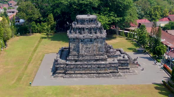 Stone building of Mendut temple, aerial drone orbit shot