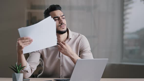 Hispanic Exhausted Male Business Man Annoyed Guy Suffer From Summer Heat in Office Home Without Air