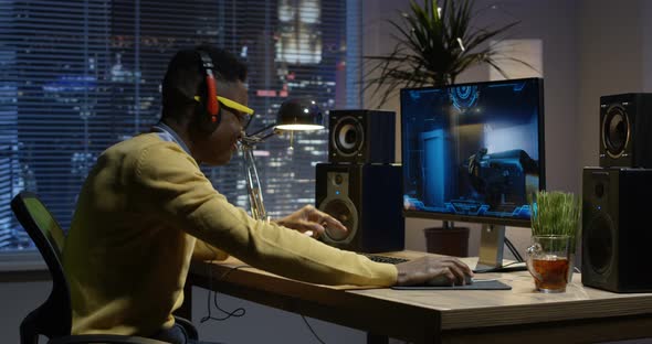 Young Man Playing Video Game Inside a Room