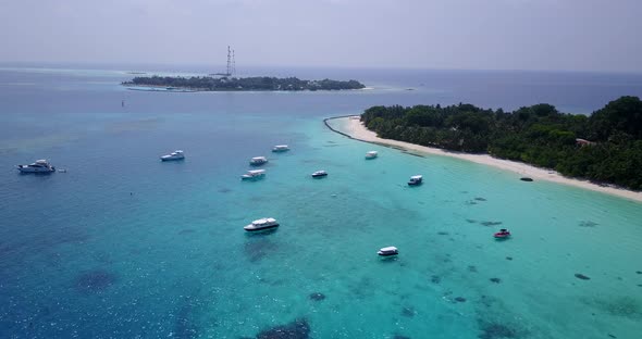 Beautiful birds eye abstract shot of a summer white paradise sand beach and aqua turquoise water 