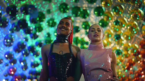 Clubbers In Pvc Fashion Walking And Smiling Amongst Neon Lights