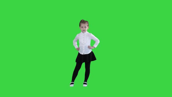 Little Smiling Girl in White Poses on a Green Screen, Chroma Key