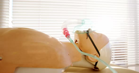 Dummy patient simulated mannequin wearing oxygen mask