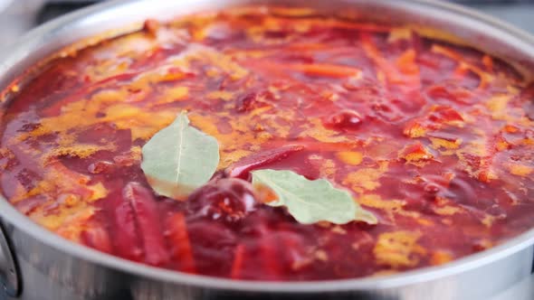 Cooking Russian beetroot soup borsch.