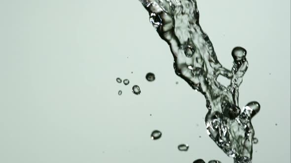 Water pouring and splashing in ultra slow motion 1500fps on a reflective surface - WATER POURS 134