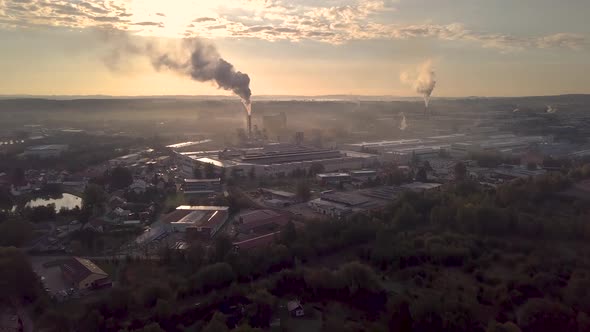 industrial cityscape with with smoking factory