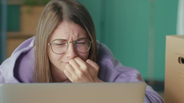Anxious Sad Woman Looking at Laptop Feeling Frustrated of Bad News