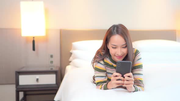 Young asian woman use smart phone