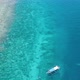 Longtail dive boat in tropical climate over coral reef, Indonesia, aerial view - VideoHive Item for Sale