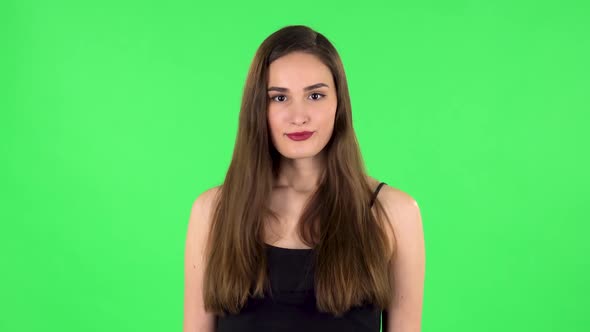 Girl Threatens with a Fist. Green Screen