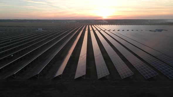 Drone Fly Over Solar Farm. Renewable Green Energy and Electrical Technology. Field of Solar Panels