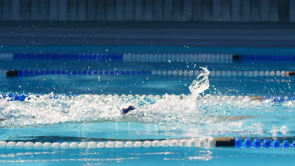 Female swimmer swimming inside pool 4k