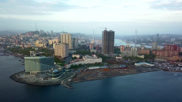 Drone View of the City and Marina Located on the Peninsula at Sunset