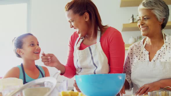 Happy multi-generation family preparing cookies in kitchen 4k