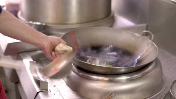 Close Up of Chef Cooking Slices of Vegetables in Frying Pan