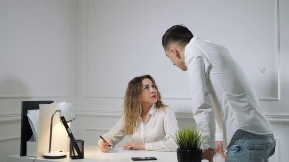 Colleagues Man and Woman Are Quarreling with Each Other in the Workplace