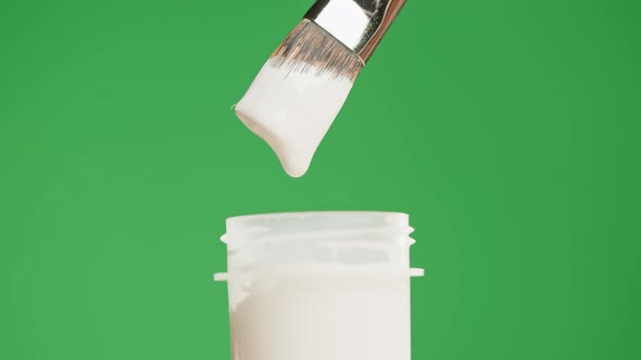 White Paint Isolated on Green Background