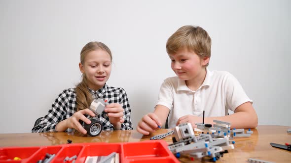 Young Friends Having Fun Using Building Kit