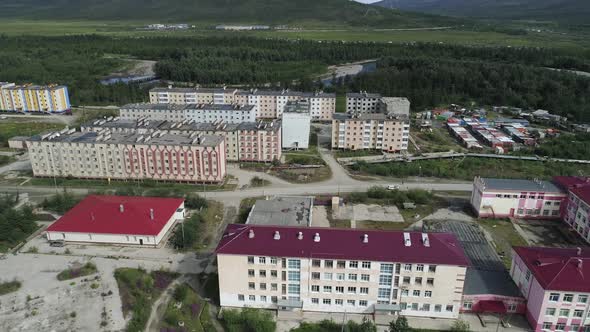 Aerial view of a small town among forests and hills. 08