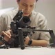 An Asian man is setting a camera rig - VideoHive Item for Sale