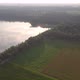 Countryside Dramatic and Colorful Sunset Flight Over a Forest Lake Aerial Shot on a Drone - VideoHive Item for Sale