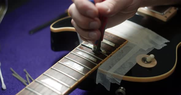 Refretting the Guitar Luthier Replaces Frets on the Electric Guitar Musical Instruments Repair Shop