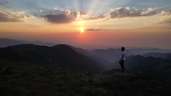 Man Watching Nature At Sunset