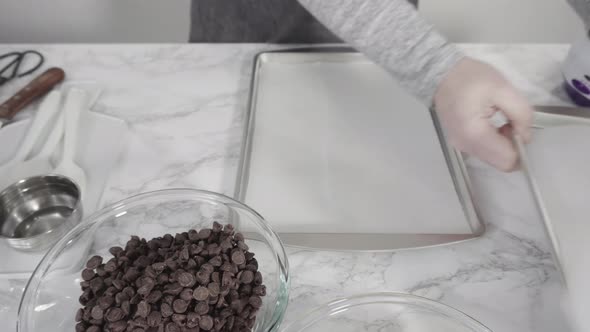 Step by step. Ingredients to prepare chocolate dipped strawberries on a marble surface.