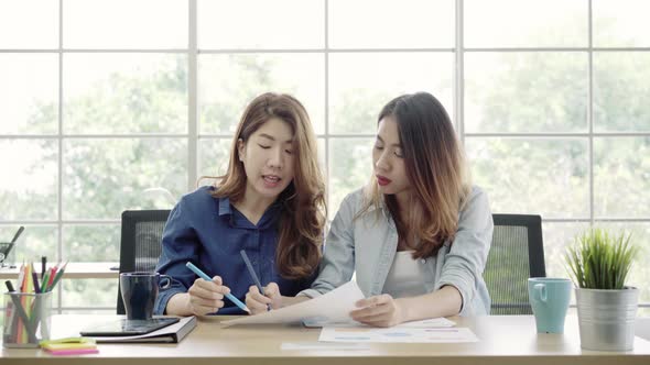 Asian creative business women brainstorming for create marketing plan in office.