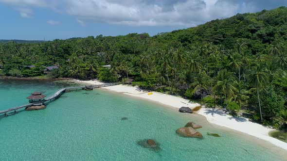 Fly out of a perfect tropical private beach in Asia