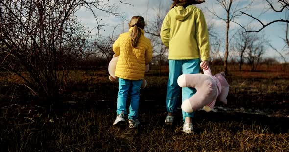 Kids Holding Fluffy Bears in Clothes in the Colors of the Ukrainian Flag