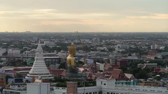 Time lapse of aerial view of the Giant Golden Buddha in Wat Paknam Phasi Charoen Temple