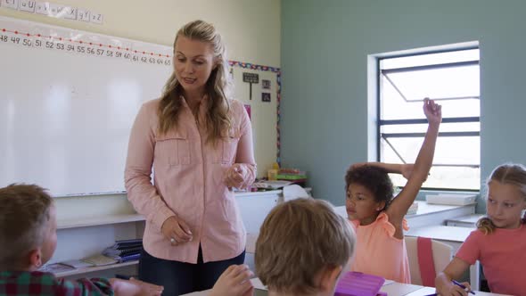 Female teacher teaching kids in the class