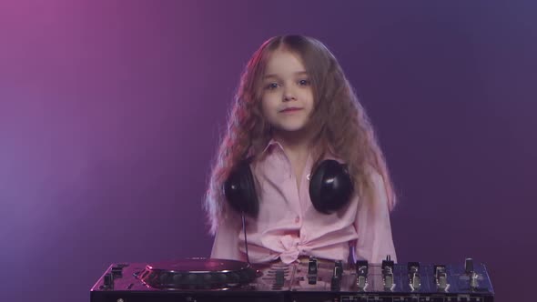 Music on Dj Console Is Performed By Little Girl Musician